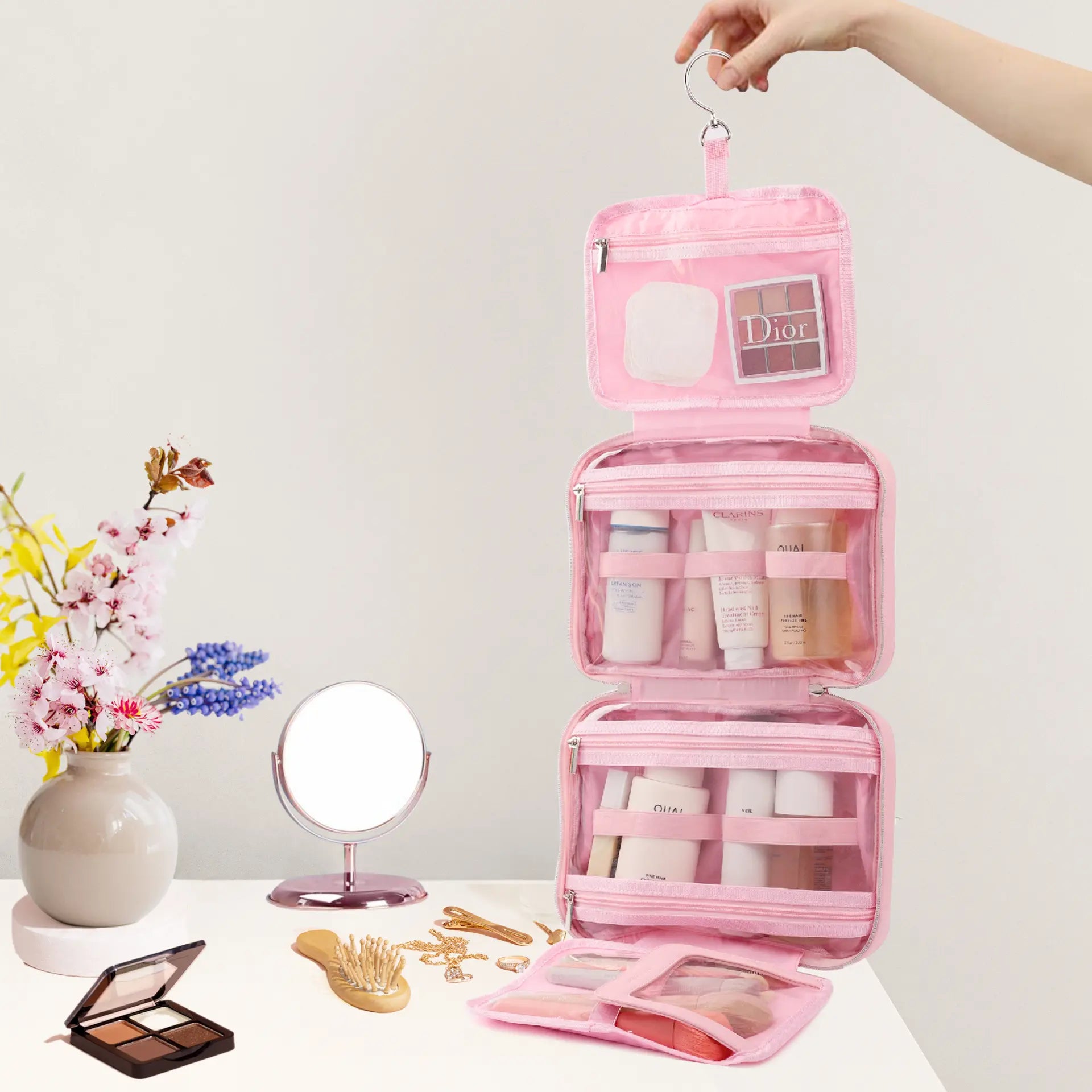 Pink toiletry bag for women with multiple compartments for organizing cosmetics